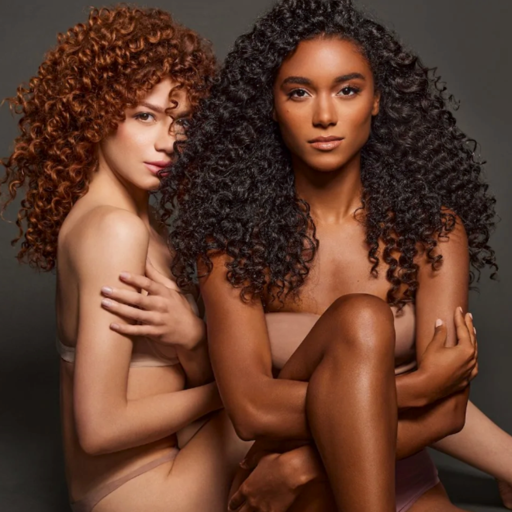 Two models with curly hair