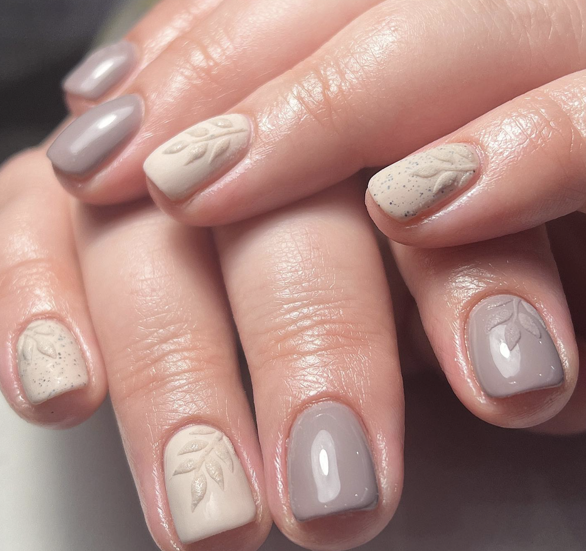 Image of nails in greige and beige with leaf detailing