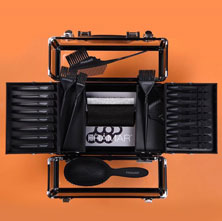 A picture of a black box containing hairdressing accessories