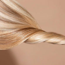 A picture of blonde hair twisted round to show colour intensity